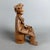 This sculpture captures the essence of Italian folk craftsmanship, reflecting the mastery of the figula tradition, likely...
