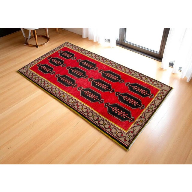 Vintage Hand Knotted Turkish Rug. Red-Black design Dimensions: 40" x 79" or 3'4" x 6'7" Material : Wool on cotton. Age:...