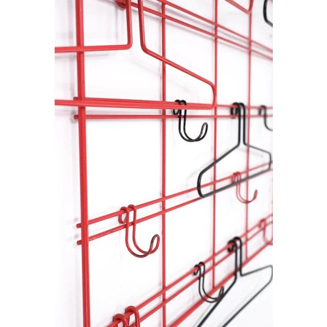 Very rare hanging wall coat rack, attributed to Coen de Vries for Devo Holland 1950s. Remarkably this set is still...