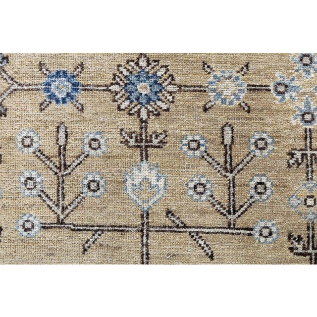 This contemporary Samarkand rug reinterprets classic Central Asian motifs through a refined, modern lens. Hand-knotted in...