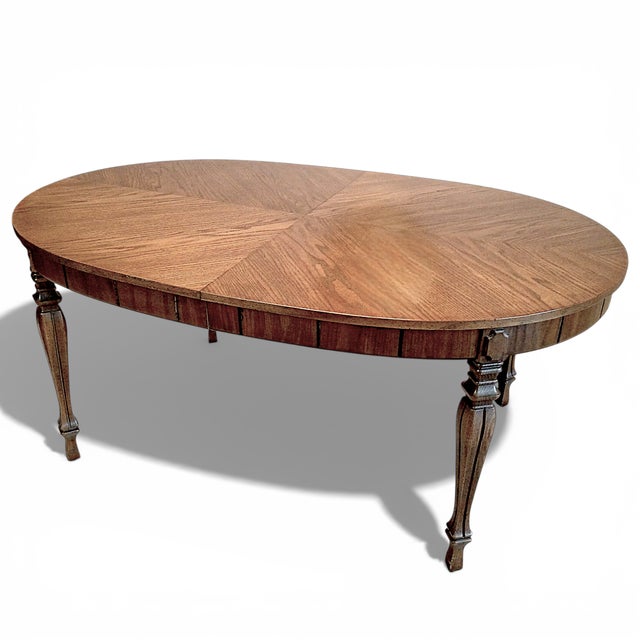 A beautiful French Regency Louis XVI style extension dining table with 3 extension leaves by Thomasville Furniture circa...
