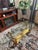 Beautiful vintage Weiman Heritage oval coffee table featuring a carved wood base with an antique gold leaf finish and a...