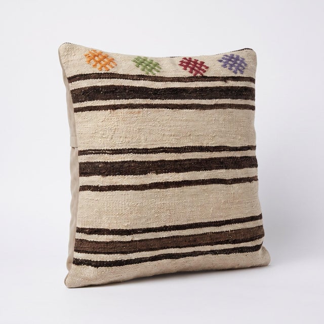 This beautiful 23'' x 23'' pillow cover was made from an authentic Turkish Kilim. Bright colors of wool adorn the front of...