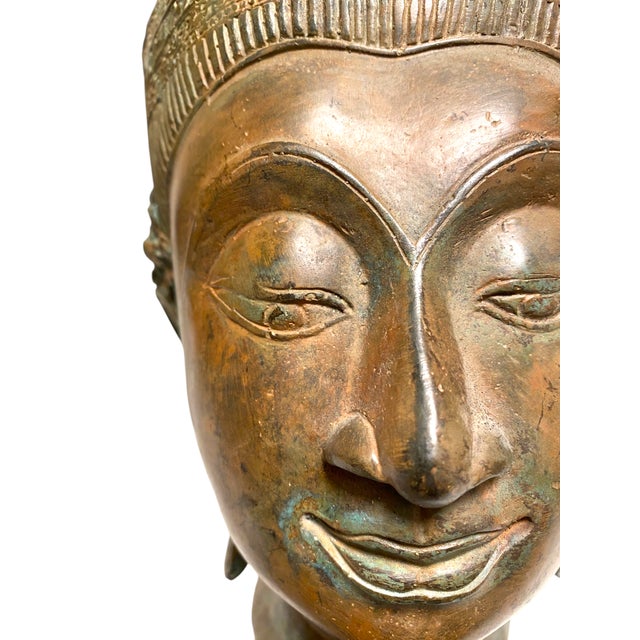 This is a stunning Thai Crowned Buddha head statue, sculpted in the traditional Ayutthaya style. The detail on it is...
