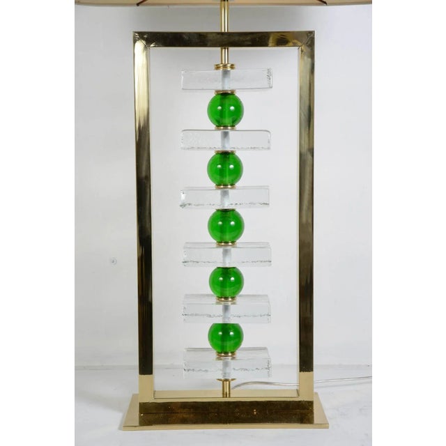 This pair of Murano glass lamps was designed in the 1970s and comes without shade. Up to 250V (Europe/UK Standard).The...