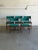 This vintage set of 5 dining chairs exhibits a classic Scandinavian silhouette featuring contoured backrests and iconic...