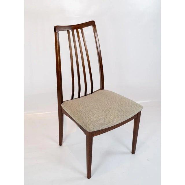 Set of six dining room chairs of rosewood and upholstered with light wool fabric, of danish design from the 1960s. The...