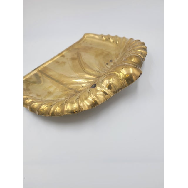 An elegant late 19th to early 20th-century solid brass crumb tray manufactured by the renowned English firm Joseph Sankey...