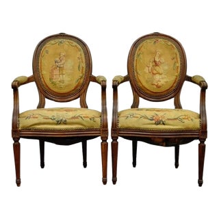 19th Century French Louis XVI Style Carved Walnut Needlepoint Arm Chairs - a Pair For Sale