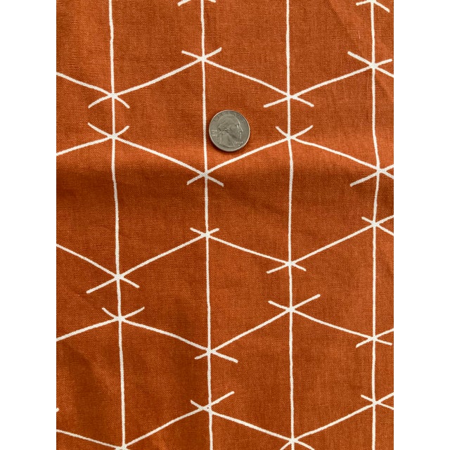 Hand printed, whimsical "criss cross" fabric from Ferrick Mason in orange colorway. Unused piece measuring 41" wide...