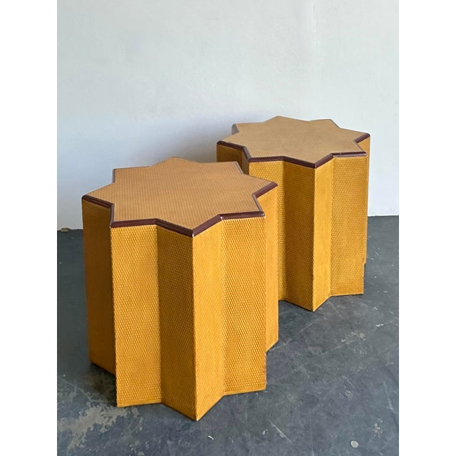 This striking pair of vintage side tables features a bold, architectural eight-pointed star silhouette that commands...