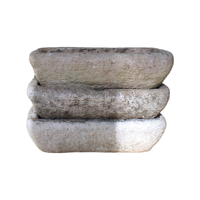 These 19th-century French antique stone sink trough, carved from solid stone with a textured, weathered surface. Its...