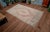 This is a beautiful vintage hand knotted distressed finish rug from Turkey. It has primary colors on green-cyanish gray...