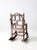 An antique Adirondack children’s rocking chair that exemplifies rustic folk art charm. Crafted from bentwood twigs, the...