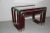 This set of 3 nesting tables was designed in the 1960s in Italy. It is made of red lacquered metal and chrome with metal...
