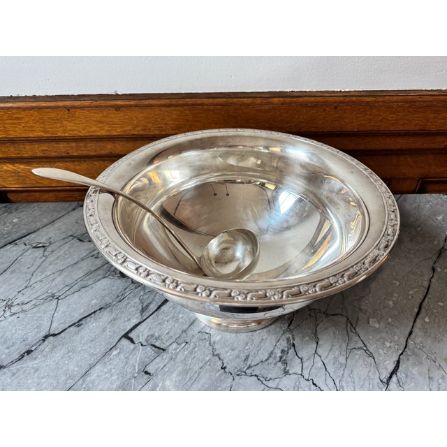 Large vintage Oneida Silversmiths silver plated punch bowl and ladle. Lovely floral decoration around the top rim. 12.75"...