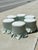 A charming set of six vintage round ottomans, newly upholstered in luxurious Scalamandré silk featuring a delicate pale...