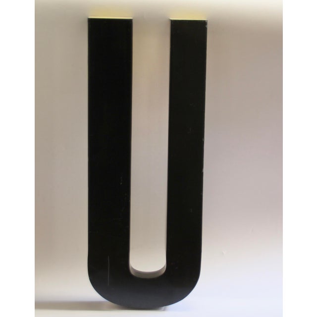 This vintage industrial letters was produced in France in the 1960s. The letter is made from lacquered metal.
