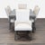 This Lexington dining set includes a sleek rectangular table and six comfortable upholstered chairs in a light neutral...