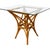 Organic modern rattan table for 4 chairs designed after McGuire. Elegant curves and leather laced joints assure quality...
