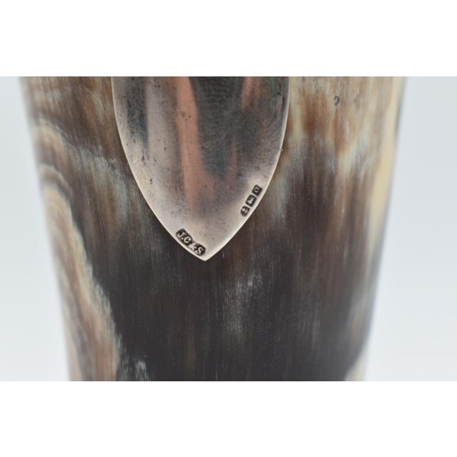 This is an amazing cup made from horn with a silver placard. It is likely made of water buffalo or bull horn. Stamped:...