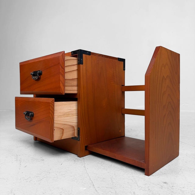 Decorative vintage Japanese desk cabinet from the 1980s, made in warm-toned wood with black metal corner fittings and...