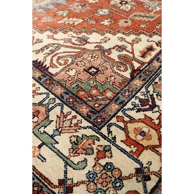 The Serapi Collection reinterprets traditional tribal geometric design through a refined palette. Each rug is hand-knotted...