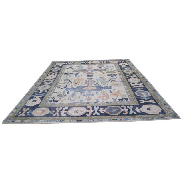 Hand-knotted with care using traditional rug-making techniques, this wool rug blends timeless craftsmanship with a modern...