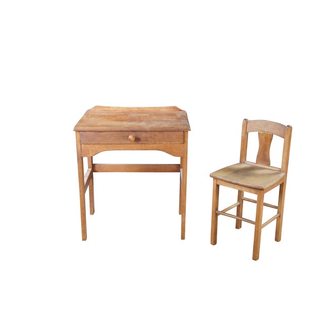 Mid 20th century childs size school desk and chair. Made from oak featuring one large drawer with turned knob. Dimensions:...