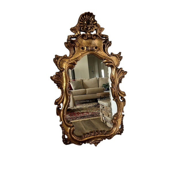 Gorgeous mid century Hollywood regency wall mirror italian 1960s Wood carved with a gold gilding very decorative piece.