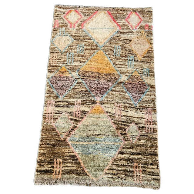 Authentic vintage Afghan tribal rug, hand-knotted in wool, featuring refined geometric patterns and a vibrant ethnic...