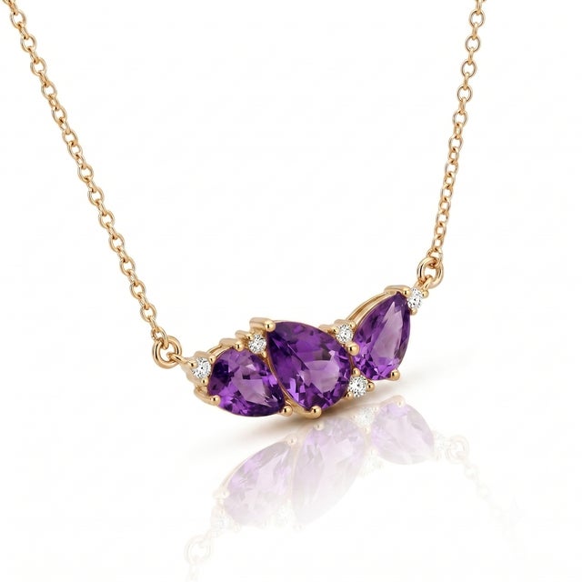 Channel royal sophistication with this deep purple Amethyst trio necklace. Featuring three pear-cut gemstones set in a...
