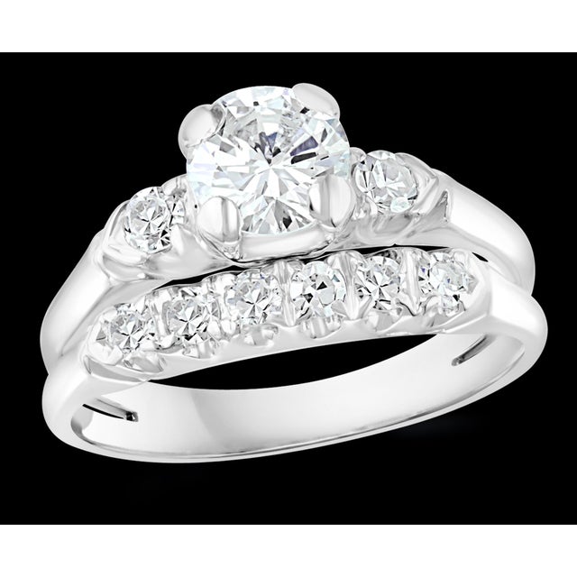 Approximately 0.6 Ct Solitaire Round Center Diamond 14 Kt White Gold Ring & Band For Sale - Image 17 of 18