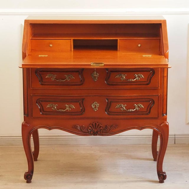 The secretary desk is a faithful reproduction in the french country style, whose design language is based on 18th-century...