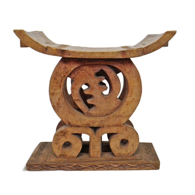 Vintage Ashanti hand carved wood stool from Ghana region. Beautiful carved details and traditional curved stool top...