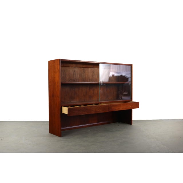 Lovely walnut mid century Danish modern storage and display case designed by Jack Cartwright for Founders Furniture, a...