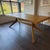 Design Within Reach Cross Extension Table in White Oak One table; three sizes. Self storing leaves allow the table to...