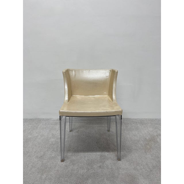 Dining or side chair by Philippe Starck for Kartell. Transparent polycarbonate frame chair with shiny ivory colored...