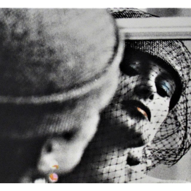 This photograph "Woman Reflecting in the Window" c.1980 is an original gelatin silver print by famous German photographer...