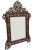 Exceptional vintage handcrafted Syrian mirror featuring an intricate hand-carved and reticulated solid walnut wood with...