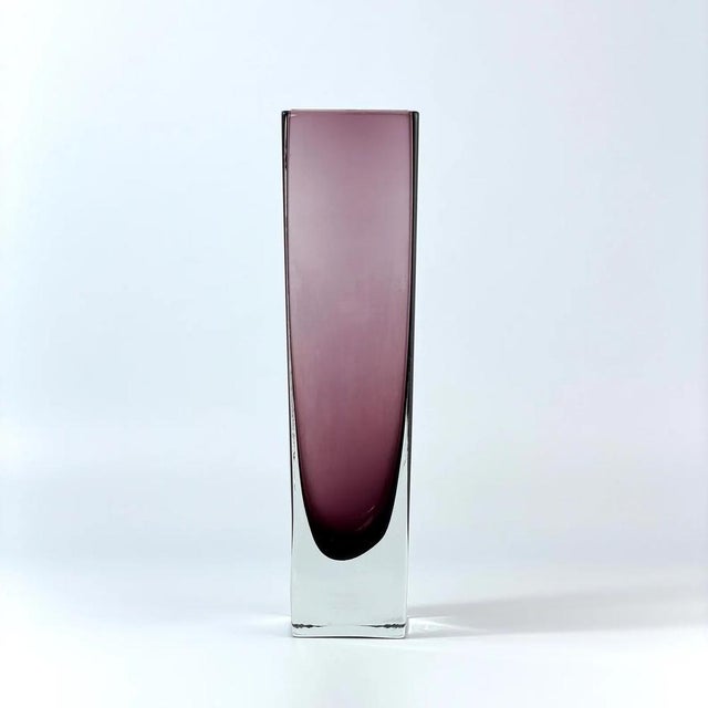 Elegant Scandinavian art glass vase produced by Sea Glasbruk, Kosta (Sweden) in the 1970s. The vase features a tall...