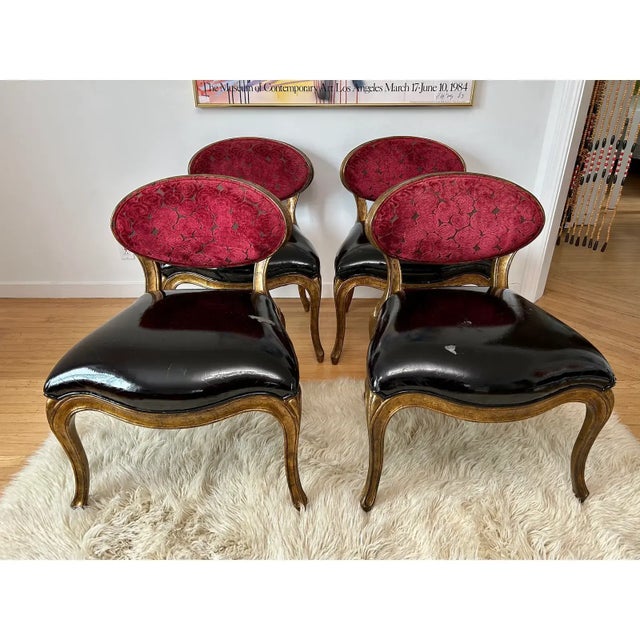 A stunning set of dining or side chairs by British luxury furniture designer Christopher Guy featuring red velvet oval...