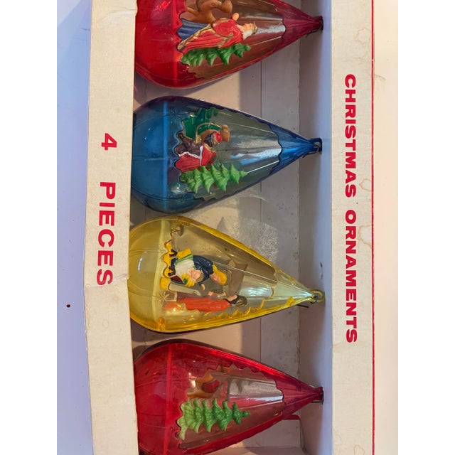 Vintage set from 1950 th of 4 drop shaped Christmas ornaments with Nativity scenes inside.