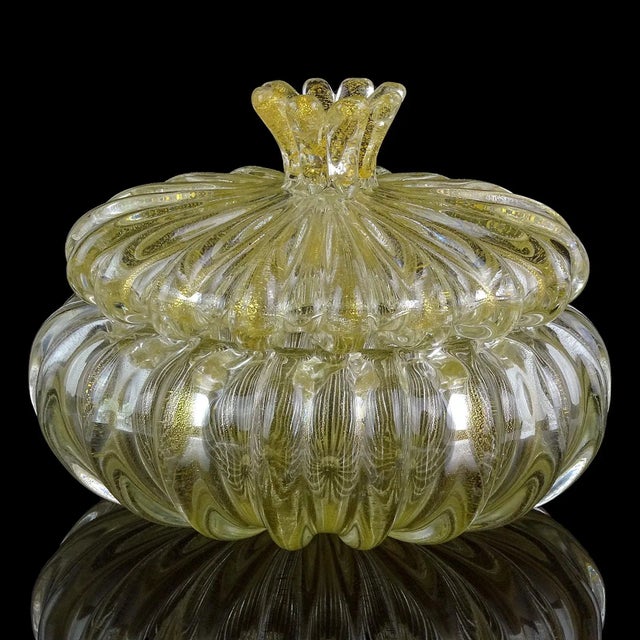 Beautiful and elegant, vintage Murano hand blown gold flecks Italian art glass vanity jewelry or powder box. The piece is...