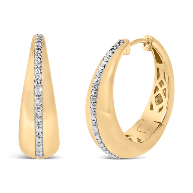Sculpted to make every turn of the head feel like a grand entrance, these bold tapered hoops marry sculptural grace with...