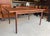 A teak extending dining table designed by ib kofod-larsen for g plan for their danish range. The rectangular top...