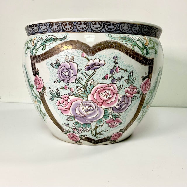 Vintage Home is pleased to offer this large Chinoiserie Famille Rose hand painted Koi Fish Bowl Planter. The design...