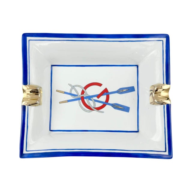 Details: -Vintage Gucci nautical rowing oars porcelain ashtray -Center of ashtray features crossed rowing oars with rope...