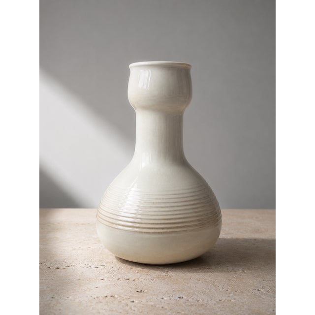 This exceptional mid-century modernist stoneware bottle vase represents a superb example of 1970s Italian studio pottery....