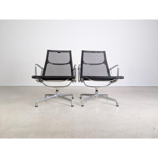 We are offering nine beautiful Vitra EA 115 mesh chairs for sale. These mesh-covered chairs were designed by Charles and...